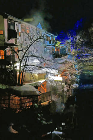 Illuminated plumes of steam from Yunishigawa's natural hot springs add to the town's romance. | STEPHEN MANSFIELD