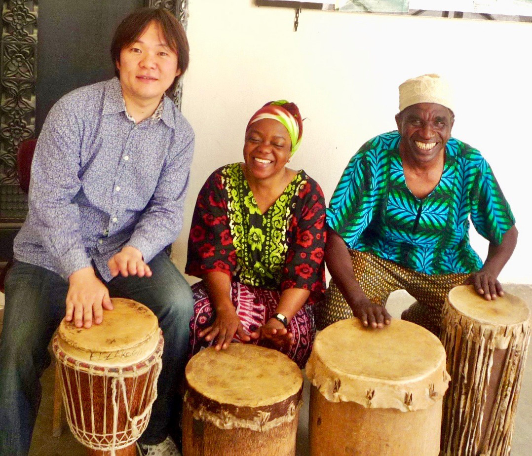 Musical travel: Motoki Hirai takes part in a drumming jam session with local musicians during a trip to Zanzibar, Tanzania. | COURTESY OF MOTOKI HIRAI