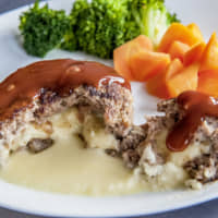 Menu staple: Cheese-filled hamburger steaks can be found at many family restaurants in Japan. | MAKIKO ITOH