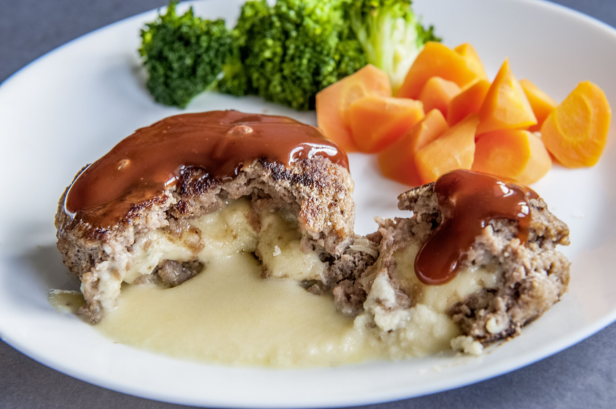 Menu staple: Cheese-filled hamburger steaks can be found at many family restaurants in Japan. | MAKIKO ITOH