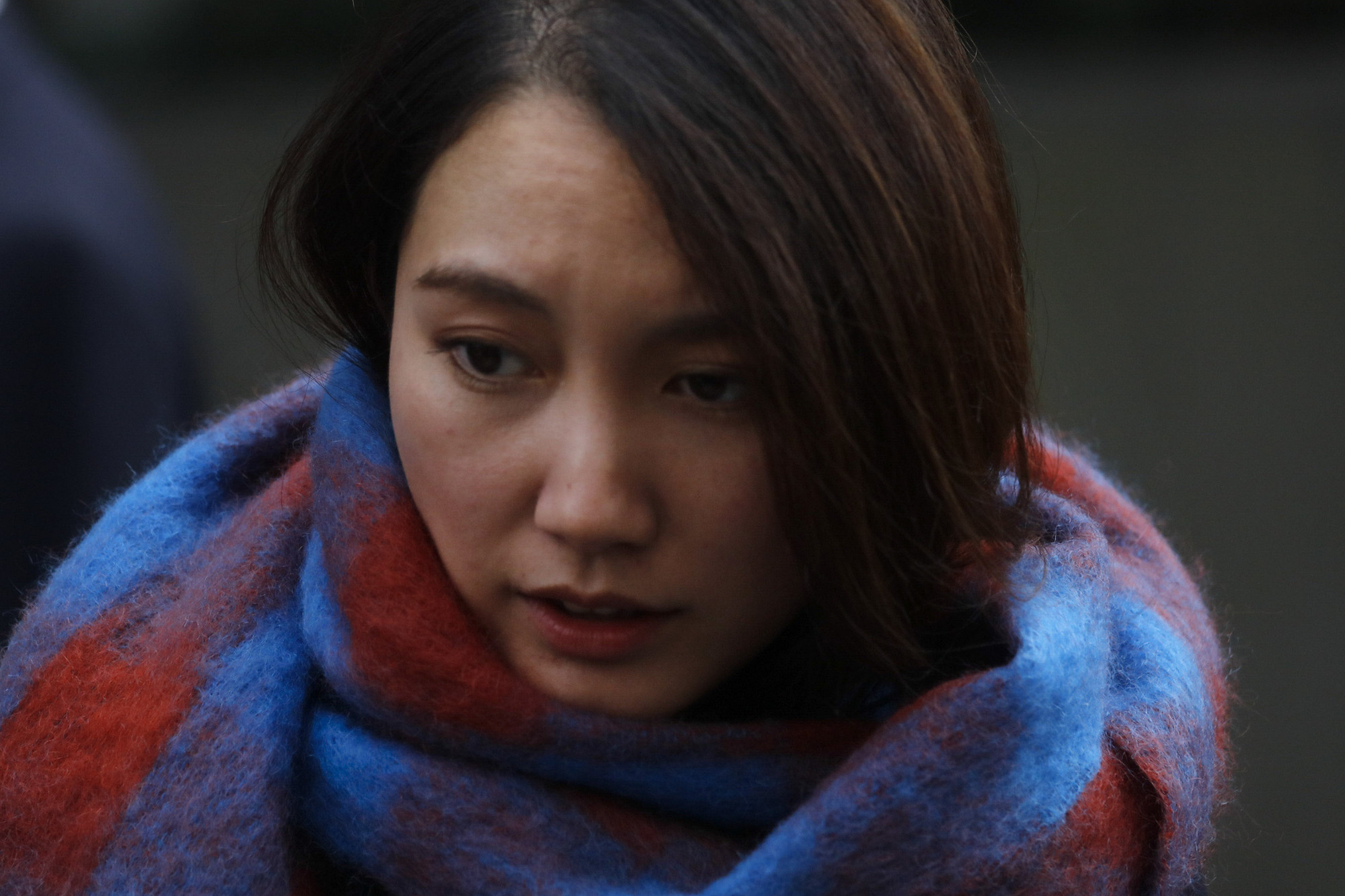Journalist Shiori Ito emerges victorious from the Tokyo District Court on Dec. 18. | AP