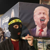 Palestinians protest U.S. President Donald Trump\'s Middle East peace proposal in the West Bank city of Nablus on Tuesday, hours before it was revealed. | AFP-JIJI