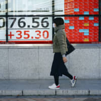 A stock board shows the Nikkei 225 average at a securities firm in Tokyo on Monday | AP