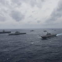 Japanese, Indian and U.S. naval vessels sail in formation during Exercise Malabar 2017. | U.S. NAVY