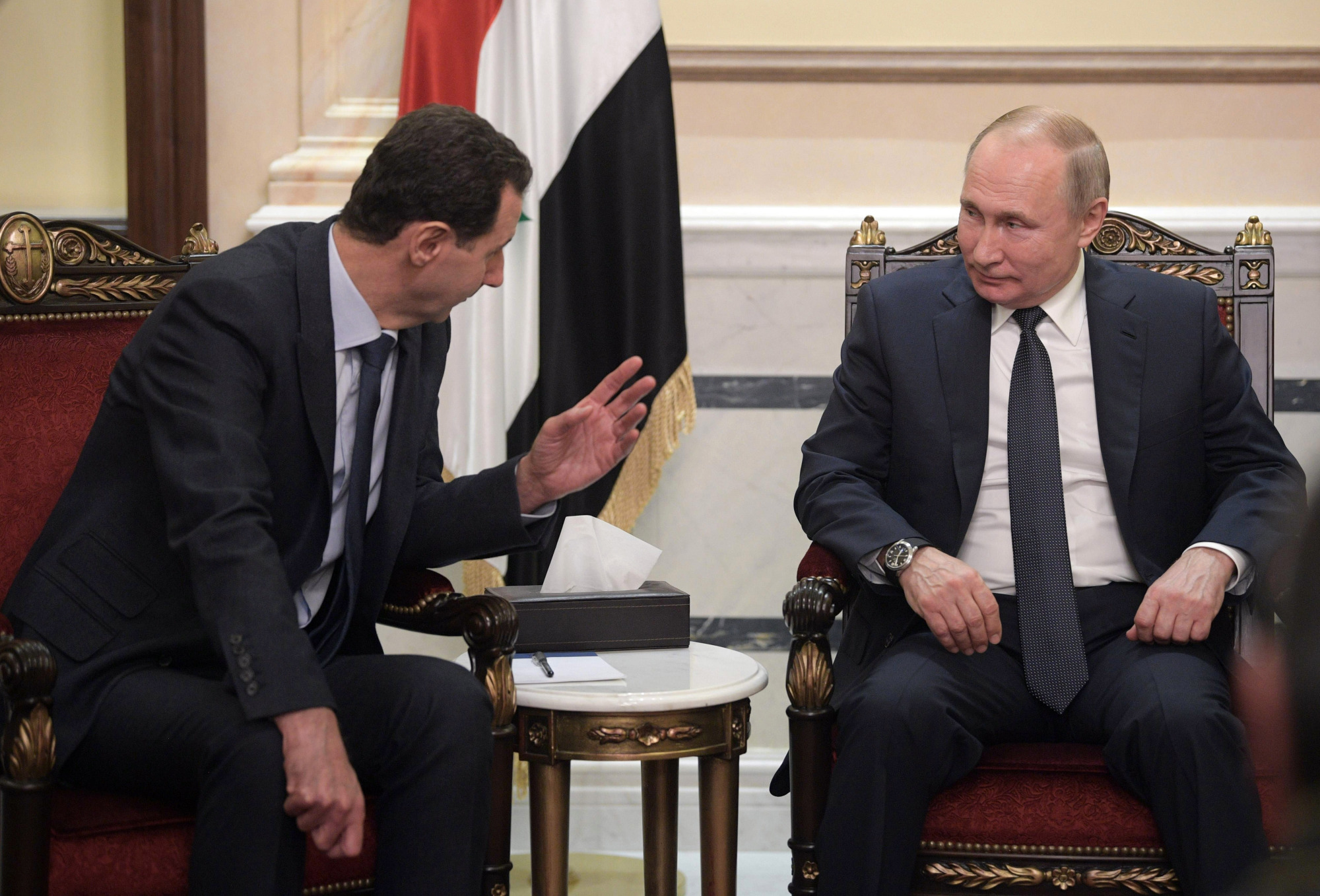 Russian President Vladimir Putin meets with his Syrian counterpart, Bashir Assad, on Tuesday following the death of Iranian Gen. Qassem Soleimani. | AP