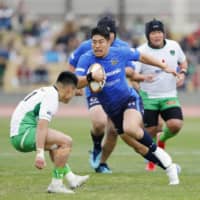 The Panasonic Wild Knights\' Rikiya Matsuda carries the ball against the Mitsubishi Sagamihara Dynaboars in a Top League match on Saturday at Sagamihara Gion Stadium. Panasonic won 62-10. | KYODO