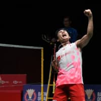 Kento Momota reacts after winning against Denmark\'s Viktor Axelsen during their men\'s singles final match at the Malaysia Masters badminton tournament in Kuala Lumpur on Sunday. | AFP-JIJI