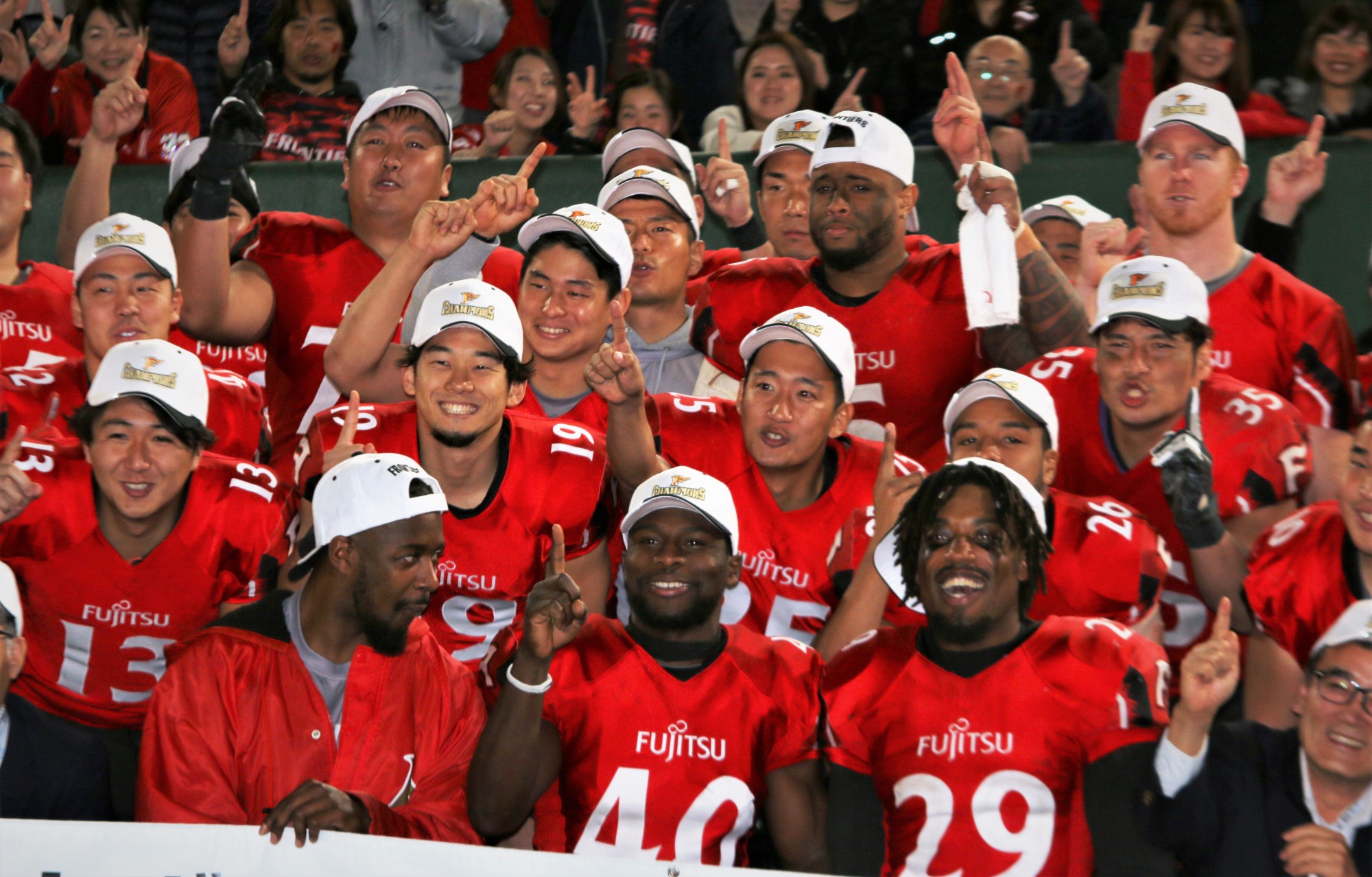 Fujitsu Frontiers players react after their 38-14 victory over Kwansei Gakuin University in the Rice Bowl on Friday at Tokyo Dome. | KAZ NAGATSUKA