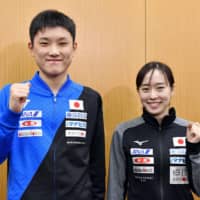 Tomokazu Harimoto (left) and Kasumi Ishikawa pose at a news conference announcing their selection to represent Japan in table tennis at the Tokyo Olympics on Monday. | KYODO