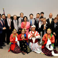 At the opening ceremony of \"Visit Nepal 2020,\" Nepalese Ambassador Prativa Rana (back row, seventh from left) poses with Parliamentary Vice-Minister for Foreign Affairs Norihiro Nakayama (back row, eighth from left); Visit Nepal 2020 goodwill ambassadors Hiromi Ishioka, chairman of the Nepal-Japan Friendship Society (back row, third from left), and Tokushin Kasai, chairman of Lumbini Hotel Kasai (back row, fourth from left); performers; and other guests at the reception hall of the ambassador\'s residence in Nakameguro on Jan. 7. | YOSHIAKI MIURA