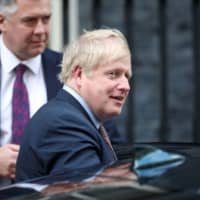 British Prime Minister Boris Johnson leaves Downing Street in London Feb. 11. | REUTERS