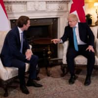 British Prime Minister Boris Johnson gestures as he meets with Austrian Chancellor Sebastian Kurz at Downing Street in London Tuesday. | REUTERS