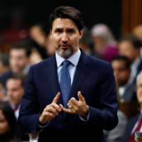Canadian Prime Minister Justin Trudeau gestures as he speaks in parliament during Question Period in Ottawa Tuesday. | REUTERS