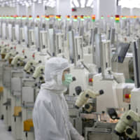 A production line at a microelectronics factory in Nantong, in eastern China\'s Jiangsu province | AP