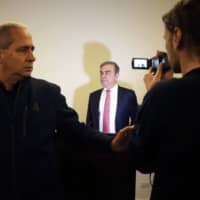 Carlos Ghosn, former chief executive officer of Nissan Motor Co. and Renault SA, prepares to speak to the media at the Lebanese Press Syndicate in Beirut, Lebanon, in January. | BLOOMBERG