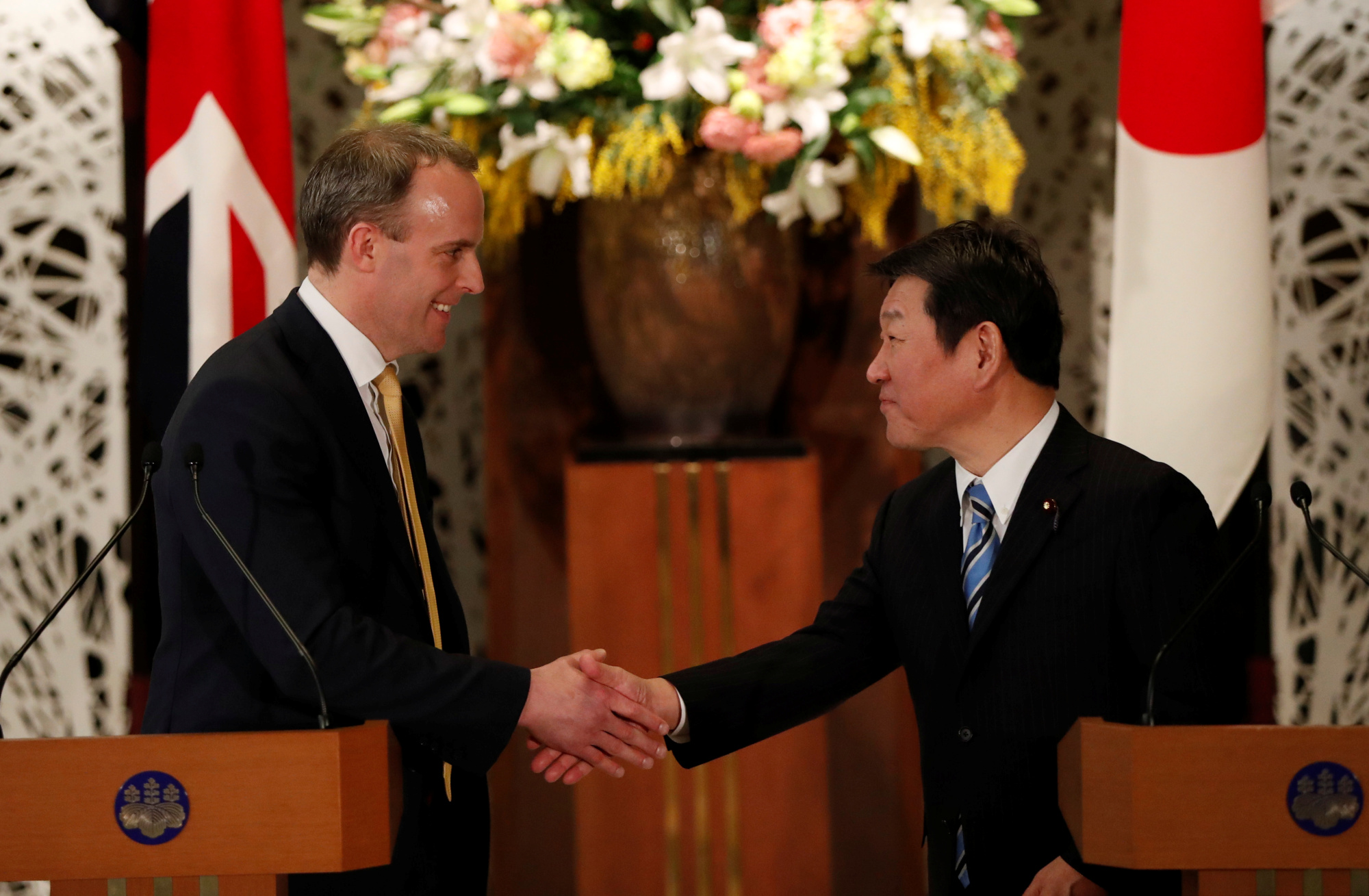 Foreign Minister Toshimitsu Motegi and his British counterpart Dominic Raab in Tokyo on Saturday | REUTERS