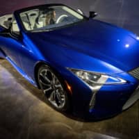 A 2021 Lexus LC 500 convertible vehicle is unveiled in Los Angeles in November. The Toyota Motor Corp. brand posted a double-digit sales gain last year. | BLOOMBERG