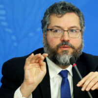 Brazilian Foreign Minister Ernesto Araujo attends a press conference at the Planalto Palace in Brasilia Tuesday. | REUTERS
