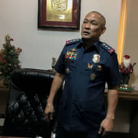 Col. Romeo Caramat, chief of the Philippine National Police Drug Enforcement Group, in his office in Manila on Dec. 11. | REUTERS