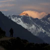 Light illuminates Mount Everest during sunset in Nepal\'s Solukhumbu district, also known as the Everest region, in this 2015 picture. | REUTERS
