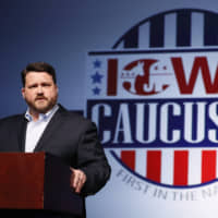 Iowa Democratic Party chairman Troy Price speaks about the delay in Iowa caucus results on Tuesday in Des Moines. | AP