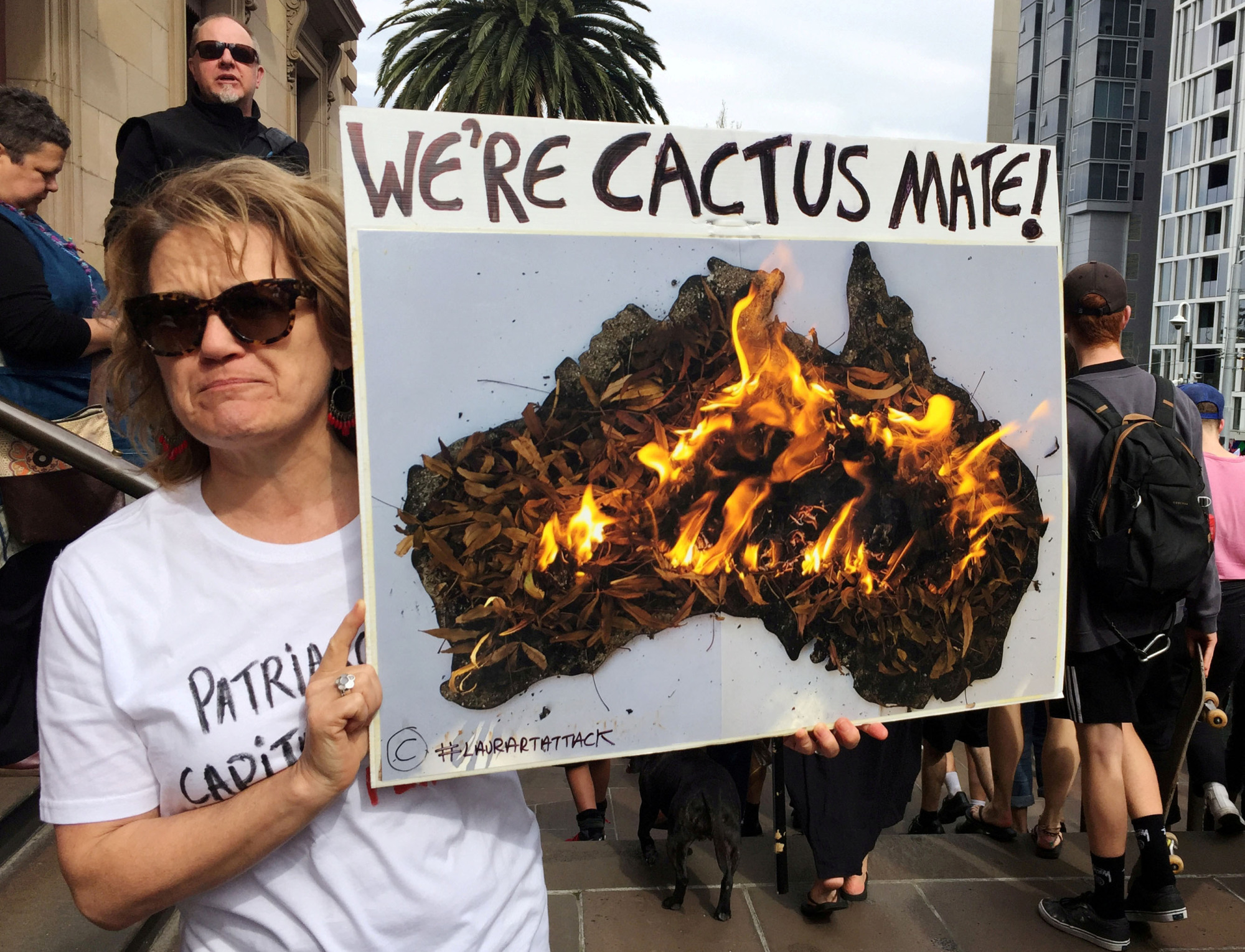 A woman takes part in a protest to call for action on climate change in Melbourne. | REUTERS