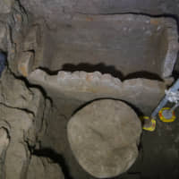 A 1.4-meter-wide sarcophagus and what appears to be an altar, dating back to the sixth century B.C., in an underground chamber at the Roman Forum. | AP