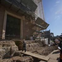 A 1.4-meter-wide sarcophagus and what appears to be an altar, dating back to the sixth century B.C., in an underground chamber at the Roman Forum. | AP