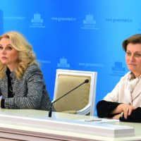 Russian Deputy Prime Minister, head of the crisis center on prevention of coronavirus spread, Tatyana Golikova (left) and Anna Popova, head of the Russian Federal Service for Surveillance on Consumer Rights Protection and Human Wellbeing (Rospotrebnadzor), attend a briefing on prevention of spread of the COVID-2019 coronavirus, in Moscow Wednesday. Three Russians evacuated from the Diamond Princess cruise ship in Japan have been diagnosed with the new coronavirus, Russian health officials said Wednesday. | ALEXANDER ASTAFYEV / SPUTNIK / KREMLIN POOL PHOTO / VIA AP