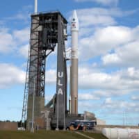 The Solar Orbiter spacecraft, built for NASA and the European Space Agency, sits atop launchpad 41 aboard a United Launch Alliance Atlas V rocket as it is prepared for launch at the Cape Canaveral Air Force Station in Cape Canaveral, Florida, Sunday. | REUTERS