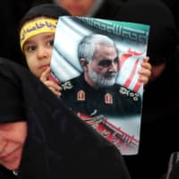 Iranians at Tehran\'s Grand Mosalla mosque on Thursday during the 40-day memorial for Quds Force commander Qassem Soleimani | WANA / VIA REUTERS