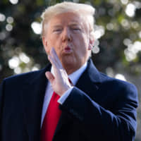 U.S. President Donald Trump speaks to the press prior to departing on Marine One from the South Lawn of the White House in WashingtonSunday, leaving on a two-day trip to India. | AFP-JIJI