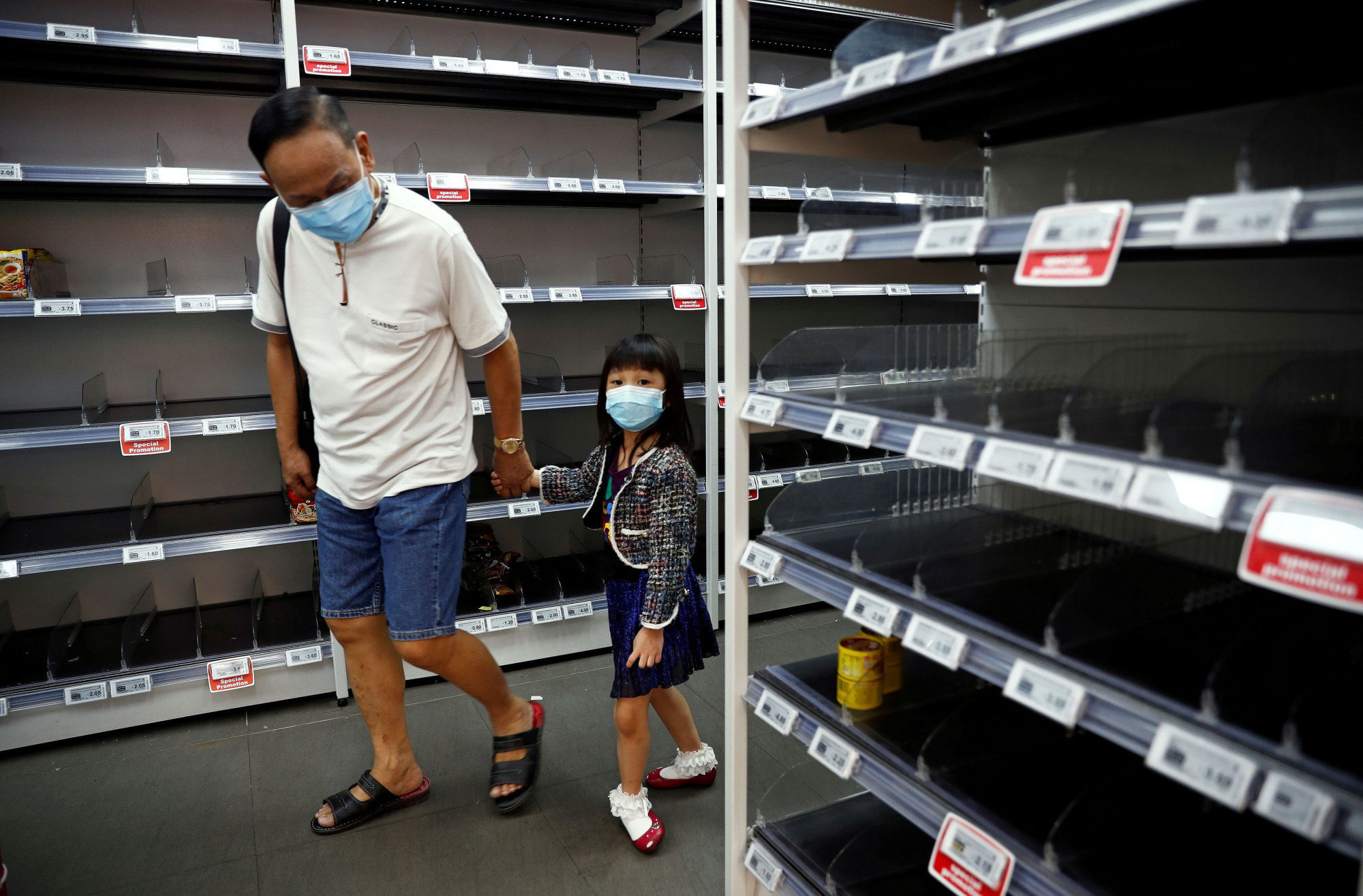 Barren supermarket shelves after Singapore raised its coronavirus outbreak alert level to orange on Feb. 8 | REUTERS
