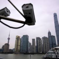 Surveillance cameras in the Lujiazui financial district of Pudong, Shanghai | REUTERS