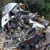 Remains of a crashed rescue helicopter are scattered in the mountains in Gunma Prefecture in August 2018. | JAPAN TRANSPORT SAFETY BOARD / VIA KYODO