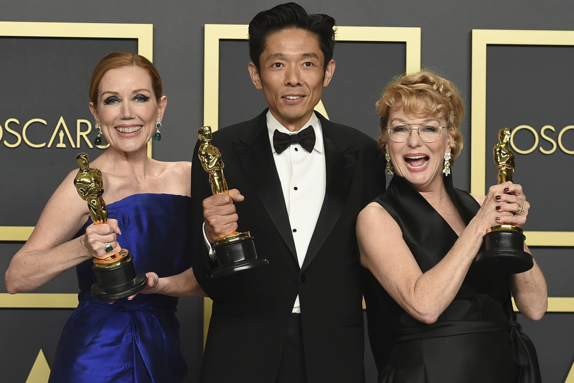 Anne Morgan (left to right), Kazu Hiro and Vivian Baker, winners of the award for best makeup and hairstyling for 'Bombshell,' pose in the press room for the Oscars on Sunday in Los Angeles. | JORDAN STRAUSS/INVISION/AP