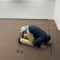 Indonesian faithful Topan Rizki Utraden prays inside the Mobile Mosque at a parking lot in Tokyo. | REUTERS