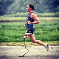 American triathlete Melissa Stockwell runs with her prosthetic leg. | COURTESY OF MELISSA STOCKWELL