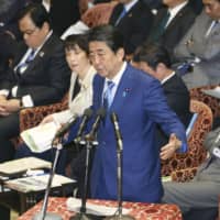 Prime Minister Shinzo Abe speaks during a Lower House Budget Committee meeting on Tuesday at the Diet. | KYODO