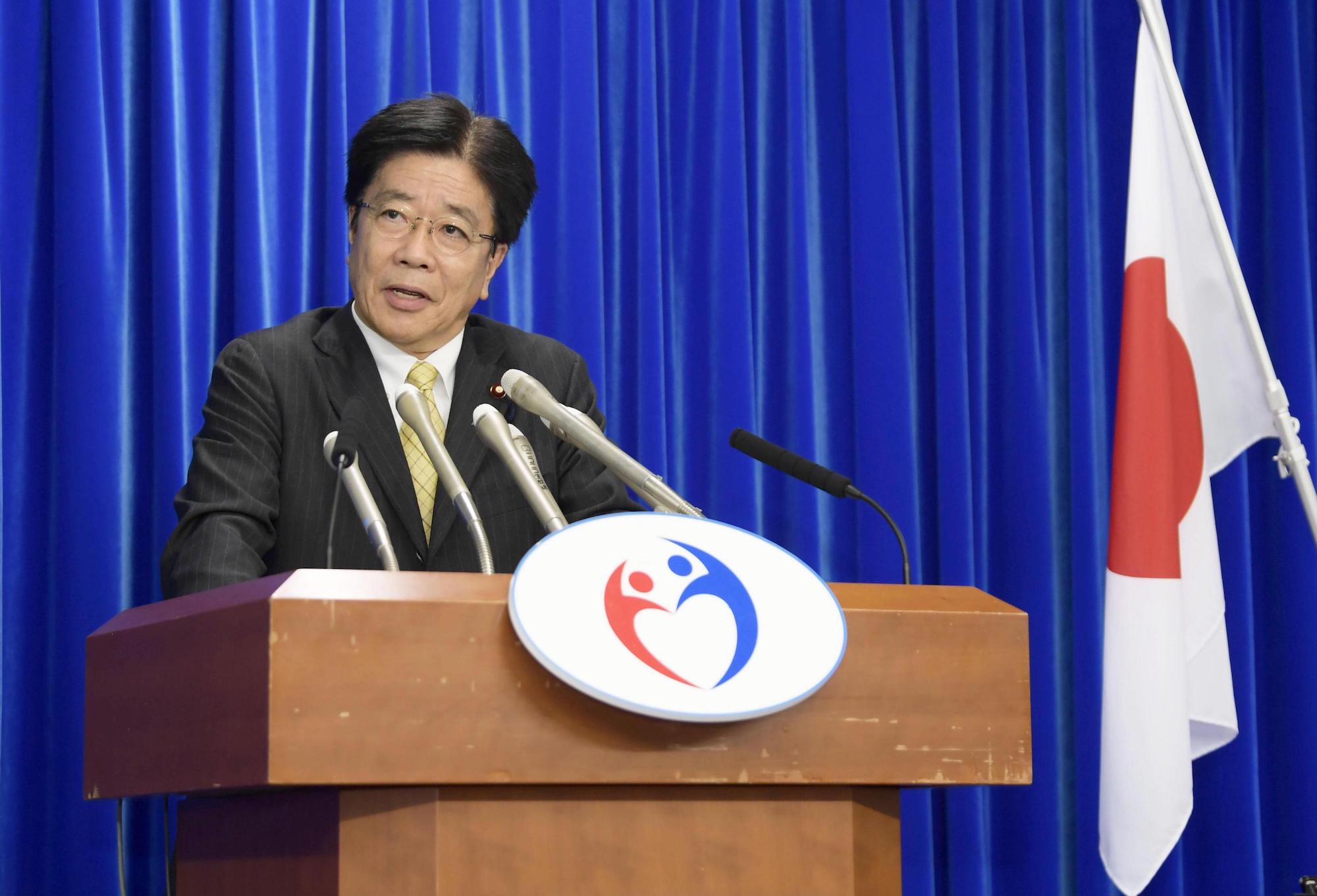 Health minister Katsunobu Kato speaks at a press conference Thursday evening about the recent domestic cases of COVID-19. | REUTERS