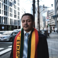 Man about town: Himneh Tegegn has been waiting for a response to his asylum claim in Japan for 11 years and, just recently, he was granted asylum in the United States instead. | JESSE CHASE-LUBITZ