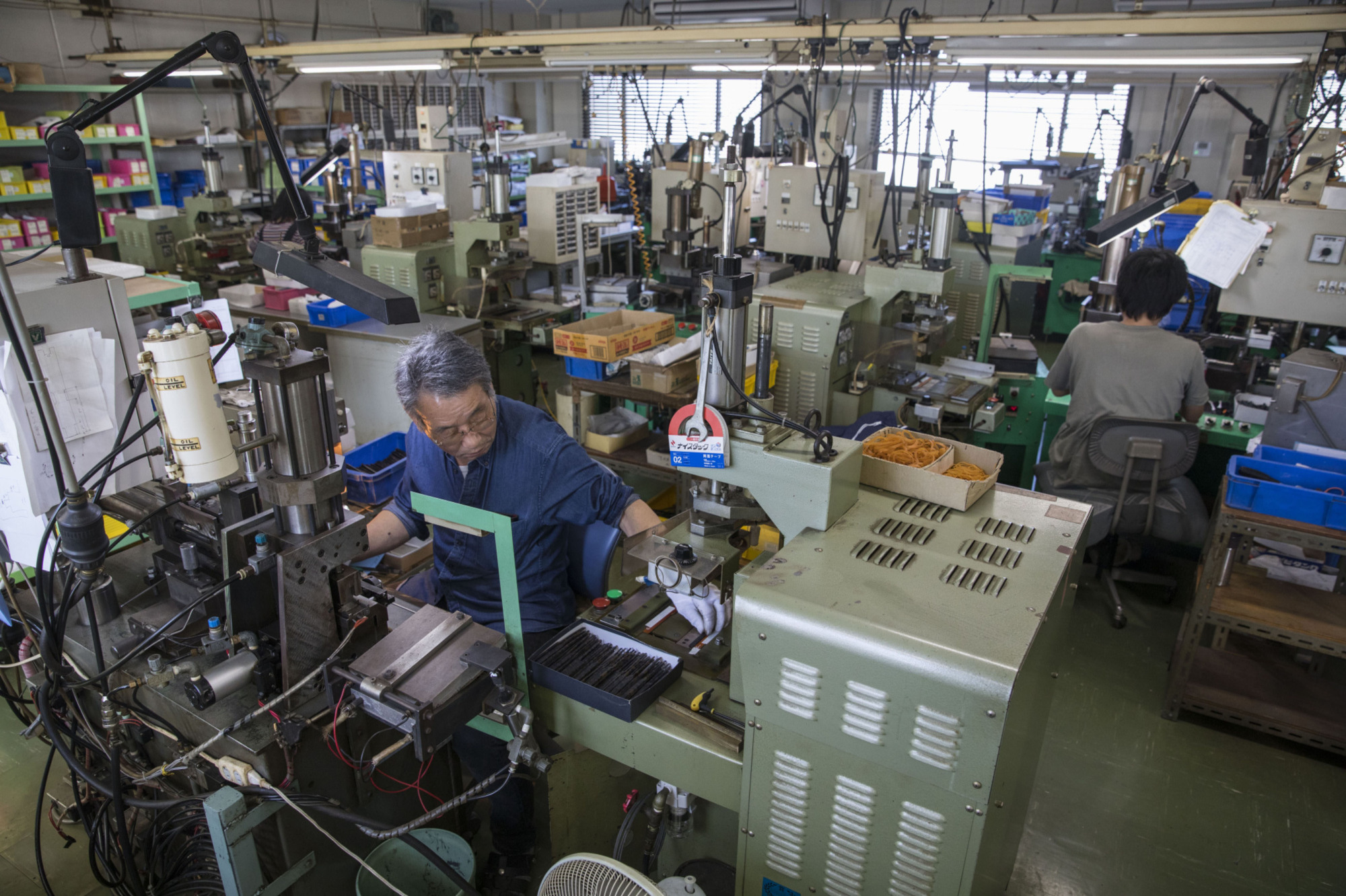 The graying and shrinking of Japan's labor force will bring an end to excessive economic competition as industries consolidate. | BLOOMBERG