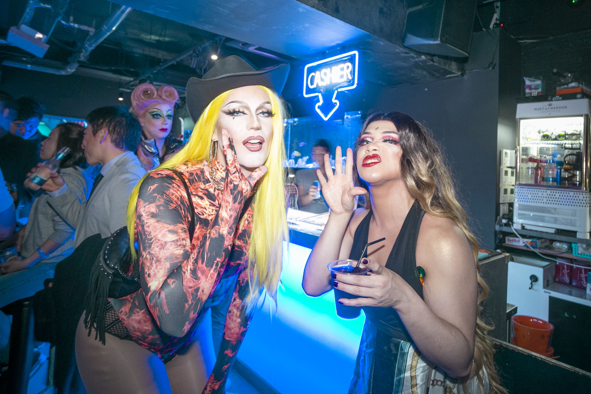 Club queens: Drag queens Sera Tonin (left) and Vera Strondh give a nod to 'RuPaul's Drag Race' in between performances at a recent Dragmania event at Eagle Tokyo Blue in Shinjuku's LGBTQ-friendly Ni-chome district. | KII CHAN
