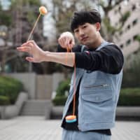 Up and down: Shu Takada credits the yo-yo with saving him from stage fright and helping him make friends overseas. | RYUSEI TAKAHASHI