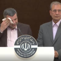 Iranian Deputy Health Minister Iraj Harirchi wipes his face during a Feb. 24 news briefing in Tehran. The next day, the government announced that Harirchi had tested positive for COVID-19 amid concerns the outbreak may be far wider in Iran than officially acknowledged. | AP