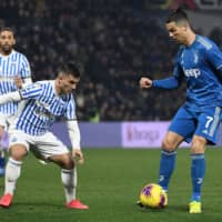 Juventus\' Cristiano Ronaldo (right) challenges SPAL\'S Gabriel Espeto in a Serie A match on Saturday in Ferrara, Italy. | AFP-JIJI