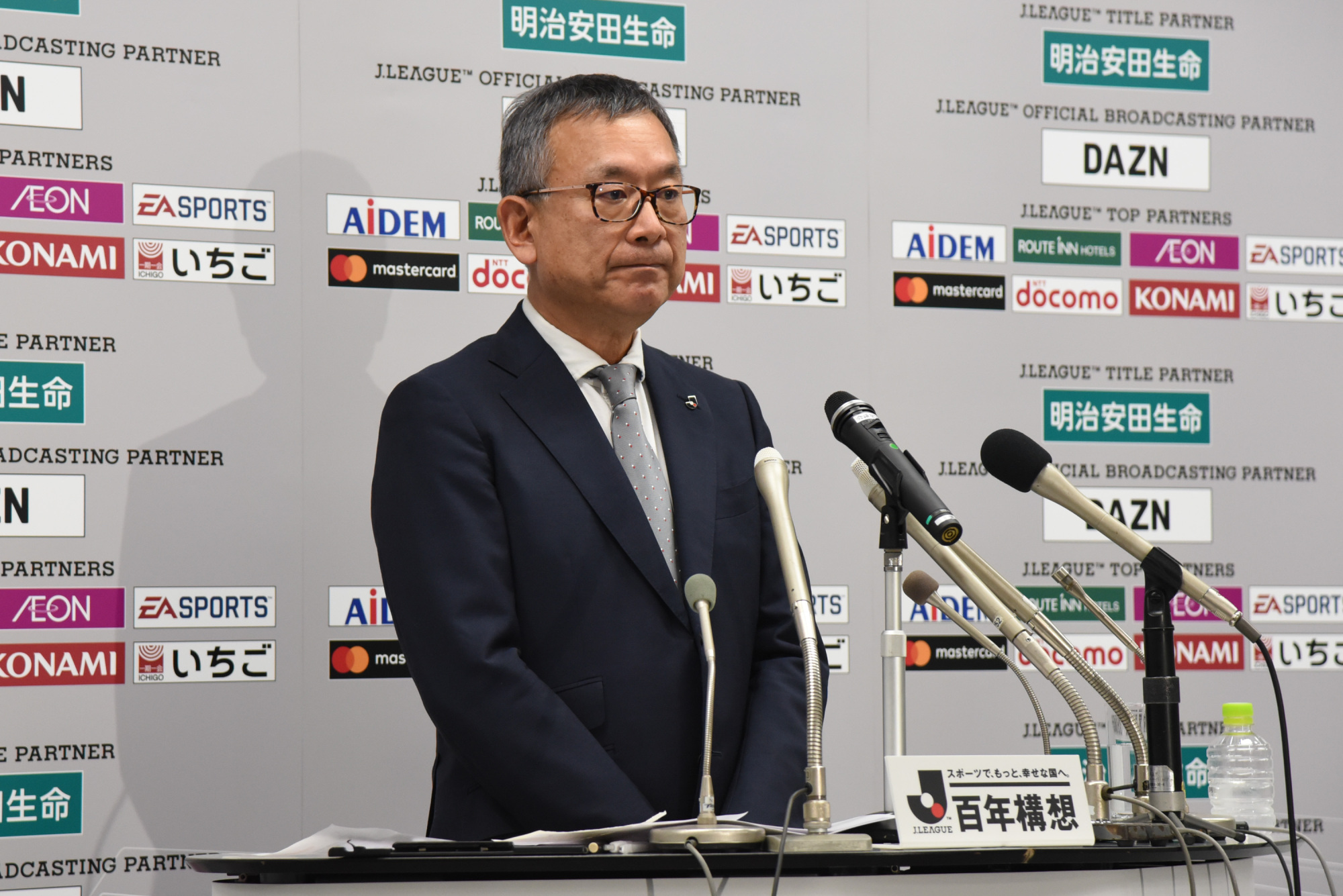 J. League Chairman Mitsuru Murai appears at a news conference announcing the postponement of matches due to COVID-19 on Tuesday at JFA House in Tokyo's Bunkyo Ward. | DAN ORLOWITZ