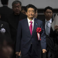 Prime Minister Shinzo Abe arrives at the completion ceremony for the new National Stadium in Tokyo on Dec. 15, 2019. | AP