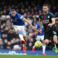 Everton\'s Richarlison scores in the 58th minute against Crystal Palace in a Premier League match at Goodison Park on Saturday. Everton defeated Crystal Palace 3-1. | REUTERS