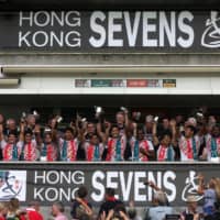 The Japanese team celebrates after beating Hong Kong on the third day of the rugby sevens tournament in Hong Kong on April 10, 2016. | AFP-JIJI